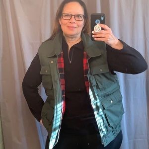 Appalachian trail full zip multi pocketed vest with thick buffalo plaid lining.